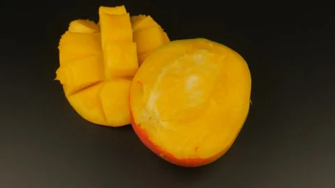 Sliced ​​Mango Rotates Beautifully Stock Footage 303267993