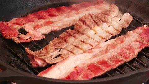 Sliced marbled beef frying in UHD Stock Footage 151657097
