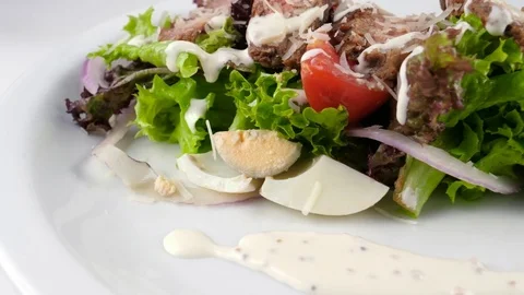 Sliced meat salad, close-up view, served in Restaurant with parmesan cheese Stock Footage 81004491