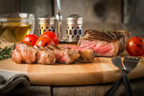 Sliced medium rare grilled Beef steak Ribeye Stock Photos