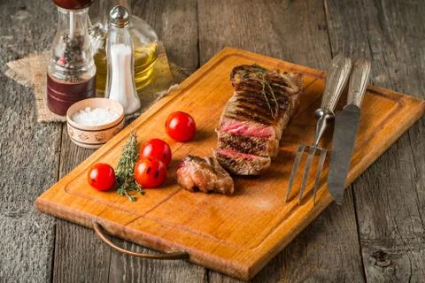 Sliced medium rare grilled Beef steak Ribeye Stock Photos