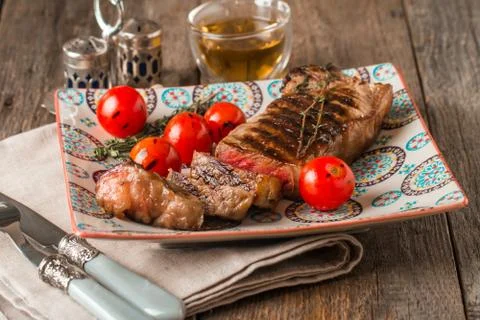 Sliced medium rare grilled Beef steak Ribeye Stock Photos