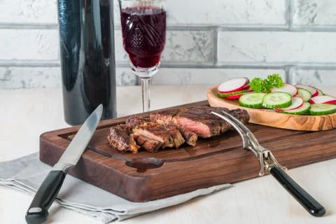 Sliced medium rare grilled Beef steak Ribeye Stock Photos