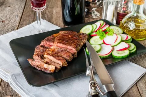 Sliced medium rare grilled Beef steak Ribeye Stock Photos