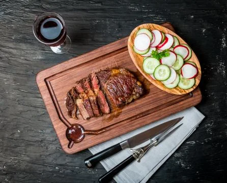 Sliced medium rare grilled Beef steak Ribeye Stock Photos