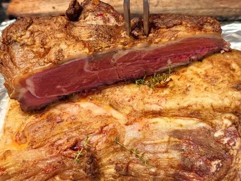 Sliced medium rare roast beef with crispy roasted crust Stock Photos