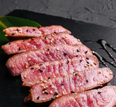 Sliced medium rare roasted beef meat pieces Stock Photos