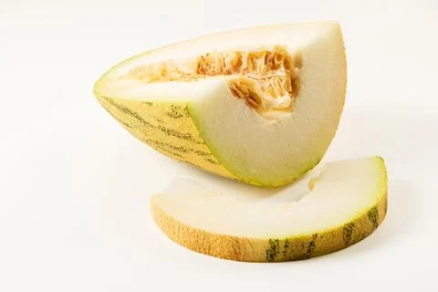 Sliced melon and melon slice on white background closeup Stock Photos