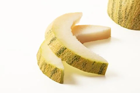 Sliced melon and melon slice on white background closeup Stock Photos