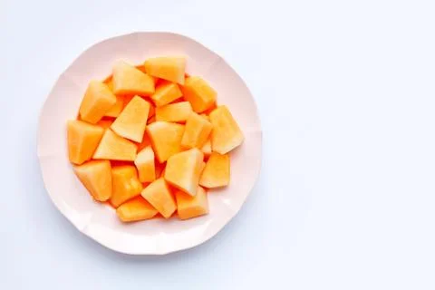 Sliced melon in dish on white background. Stock Photos