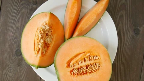 Sliced melon on a plate. Video stock 297364888
