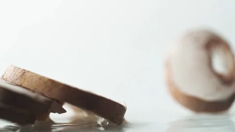 Sliced mushroom falling on water surface. Slow Motion. Stock Footage 79475731