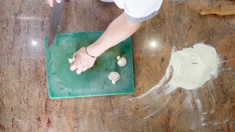 Sliced mushrooms in the kitchen on a cutting board. top view Stock Footage