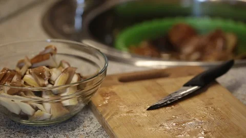 Sliced mushrooms in the kitchen Stock Footage 88997973