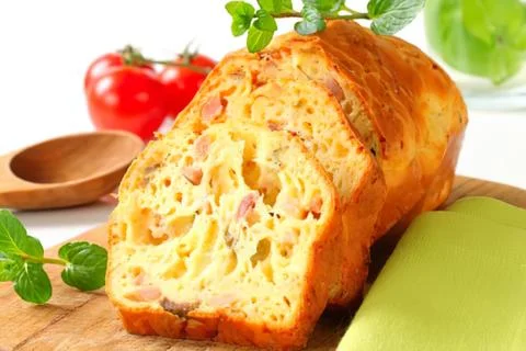 Sliced nut bread loaf with fresh herbs Stock Photos