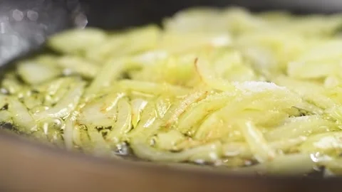 Sliced onion is fried in a pan. Stock Footage 152529978
