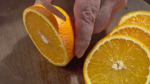 Sliced orange closeup on a black background Stock-Footage 134531370