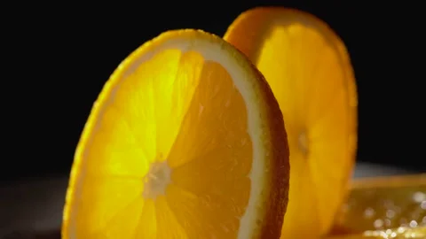Sliced orange closeup on a black background 動画素材 134532767