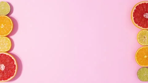 Sliced orange grapefruit, lemon and lime appear . Stop motion flat lay Stock Footage 152906826