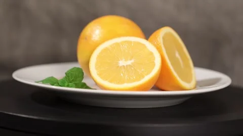 Sliced Orange with Mint on Plate 01 Video stock 293003556