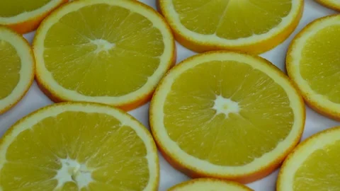 The sliced oranges are rotating. Stock Footage 255574339