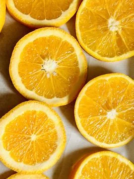 Sliced Oranges on a baking parchment Stock Photos