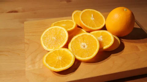 Sliced oranges on a cutting board Stock Footage 52089134