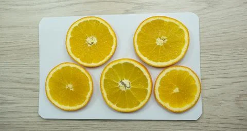 Sliced oranges for drying on paper Stock Photos
