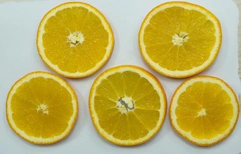 Sliced oranges for drying on paper Stock Photos