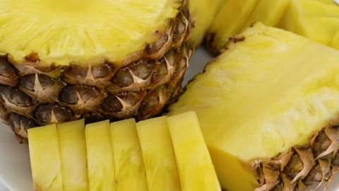 Sliced pieces delicious pineapple fruit. Tropical summer food concept. Rotate Stock Footage 152779635