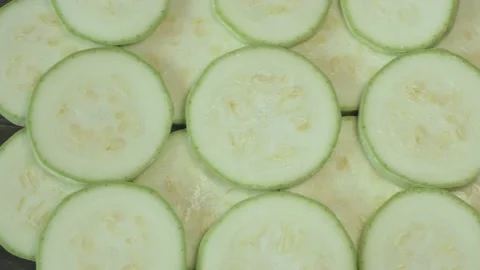 Sliced pieces of fresh squash on a  cutting board Stock Footage 134069174