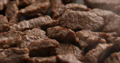Sliced pieces of meat are fried in a frying pan. Stock Footage 250519689