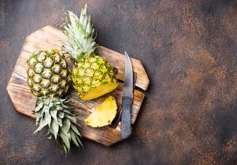 Sliced pineapple on cutting board Stock Photos