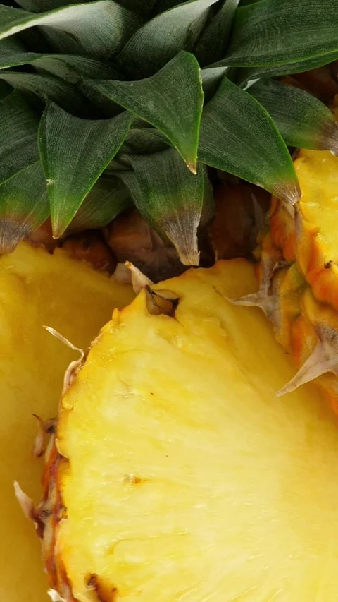 Sliced pineapple fruit. rotating. Vertical Stock Footage 308051831