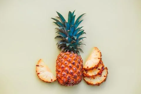 Sliced pineapple on a light colored background Stock Photos