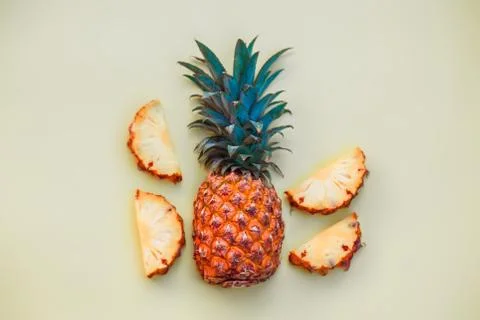 Sliced pineapple on a light colored background Stock Photos