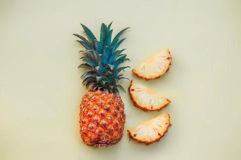 Sliced pineapple on a light colored background Stock Photos