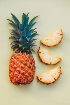 Sliced pineapple on a light colored background Stock Photos