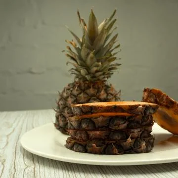Sliced pineapple over white background . Stock Photos