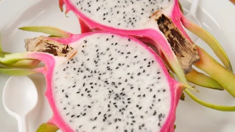 Sliced pitahaya on a plate. Video stock 245833782