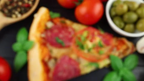 Sliced pizza on the table in the restaurant. High Angle View Of Pizza In Plat Vídeos de archivo 208627231