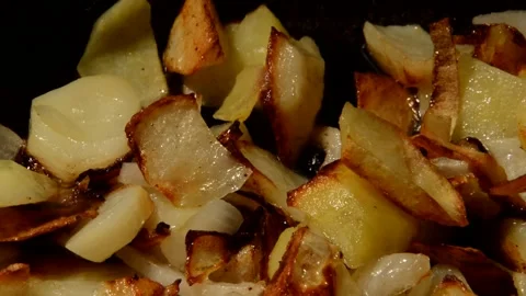 Sliced potato with onion are fried Stock Footage 272170460