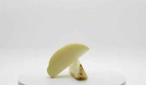 Sliced Potato Rotating on Turntable Stock Footage 230746058