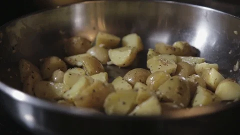 Sliced Potatoes In A Light Oil Medium-High Heated Skillet - Close Up Shot Video stock 122102601