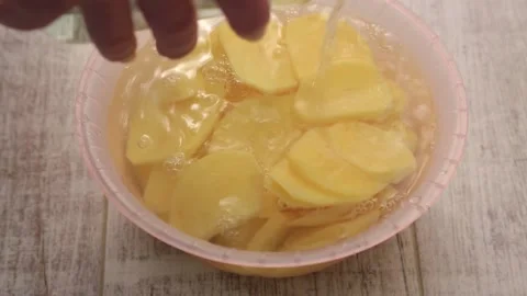 Sliced ​​potatoes in water Stock Footage 155653571