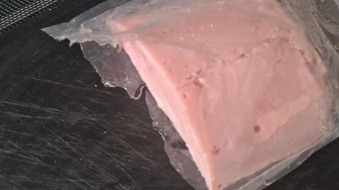 Sliced processed meat product in plastic packaging motion video clip Stock Footage 339247387