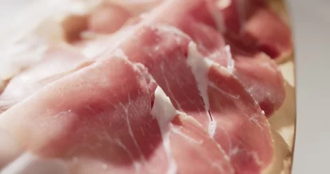 Sliced prosciutto on cutting board Stock Footage 319402035
