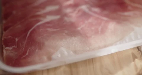 Sliced prosciutto on cutting board Stock Footage 319402048