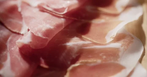 Sliced prosciutto on cutting board Stock Footage 319402050