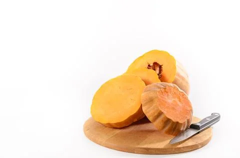 Sliced pumpkin on a light background Stock Photos